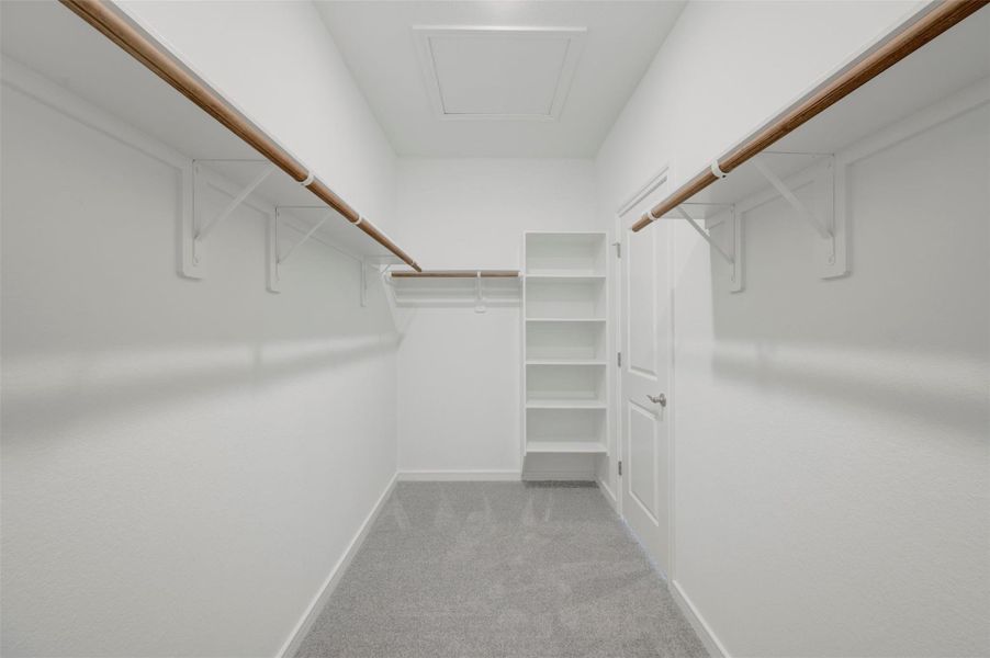 Primary walk-in closet Primary walk-in closet