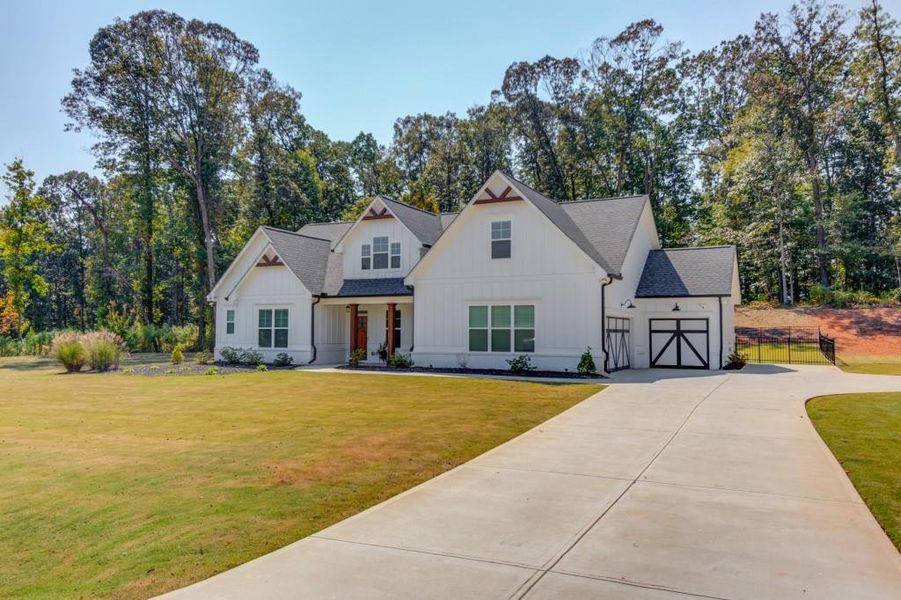 Front exterior of a new home in , Jefferson, GA, highlighting curb appeal (Image 21).