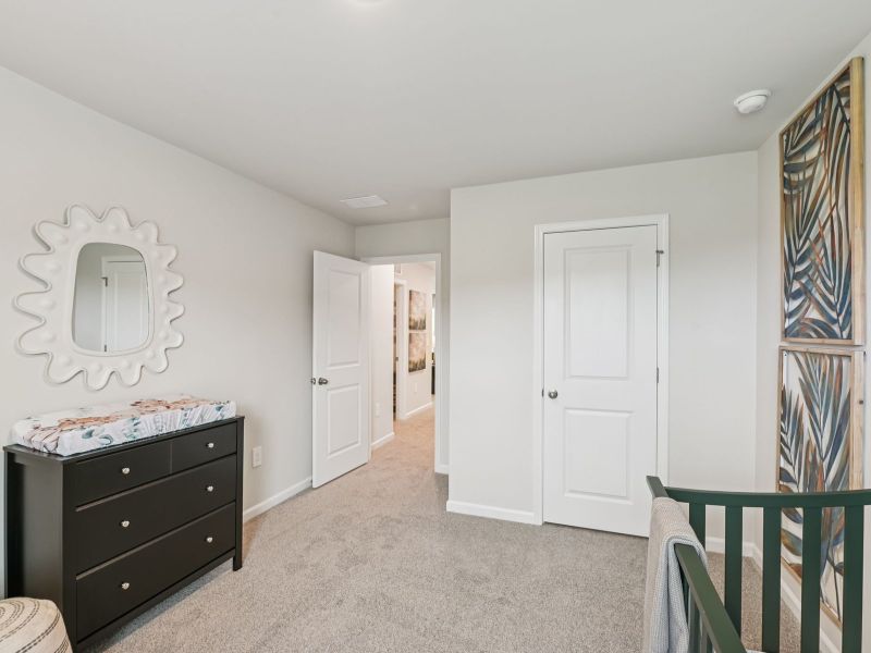 Secondary bedroom in the Chatham floorplan at a Meritage Homes community in Mebane, NC. Secondary bedroom in the Chatham floorplan at a Meritage Homes community in Mebane, NC.