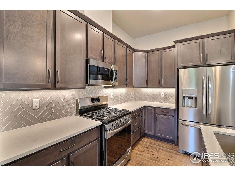 Lovely Cabinets, Countertops and Backsplash Plus Under Cabinet Lighting