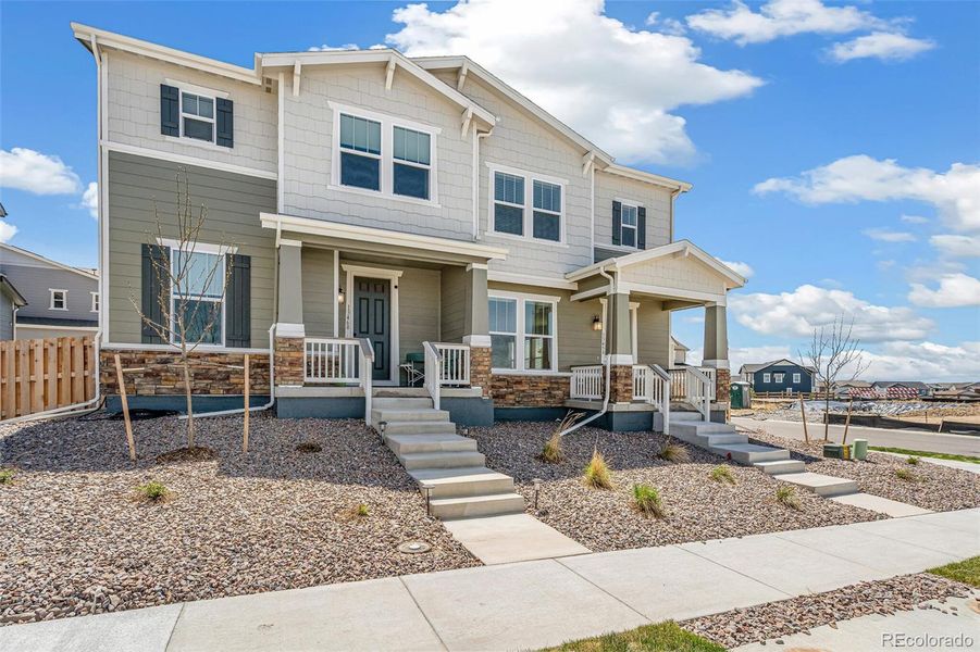 Front exterior of a new home in Turnberry, Commerce City, CO, highlighting curb appeal (Image 2). Front exterior of a new home in Turnberry, Commerce City, CO, highlighting curb appeal (Image 2).