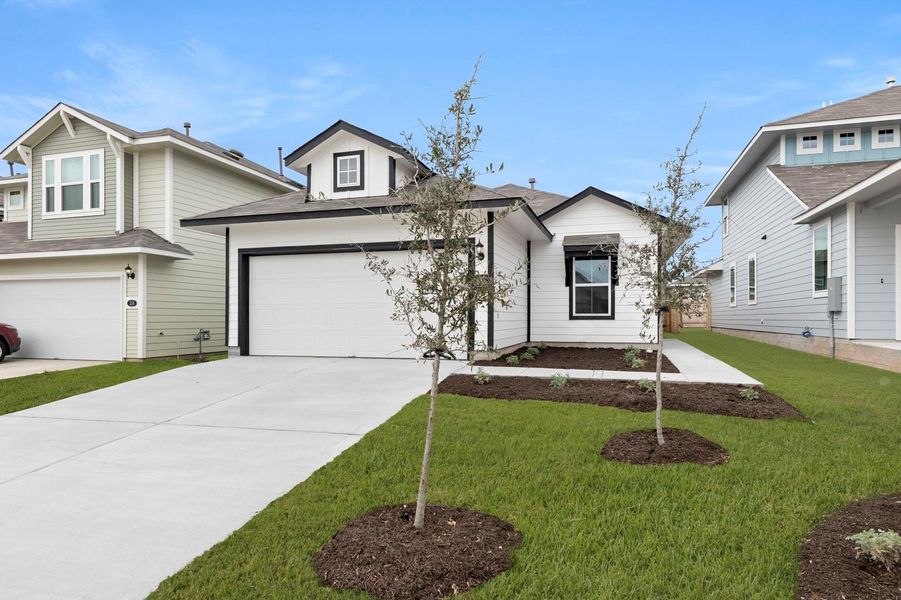 Front exterior of a new home in Hymeadow, Maxwell, TX, highlighting curb appeal (Image 18).