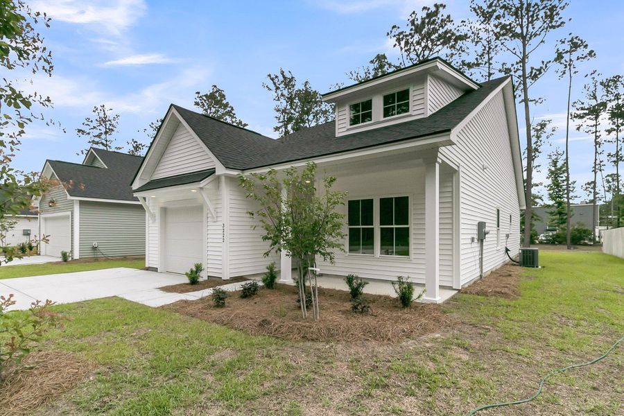 Front exterior of a new home in , Ladson, SC, highlighting curb appeal (Image 25).