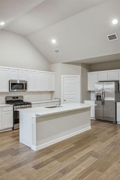 Kitchen in the Wimbledon home plan by Trophy Signature Homes – REPRESENTATIVE PHOTO