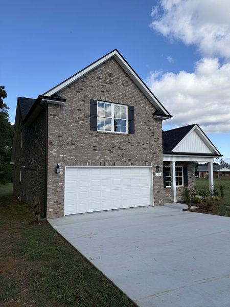 Front exterior of a new home in Fox Run, Manchester, TN, highlighting curb appeal (Image 2). Front exterior of a new home in Fox Run, Manchester, TN, highlighting curb appeal (Image 2).