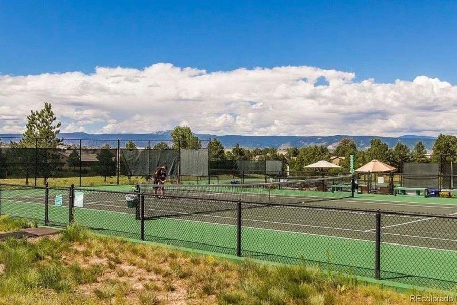 The Canyon Club is part of the association dues in The Village at Castle Pines and features 5 tennis courts, 4 pickleball courts, a large pool, playground, sand volleyball court, and entertainment pavillion.