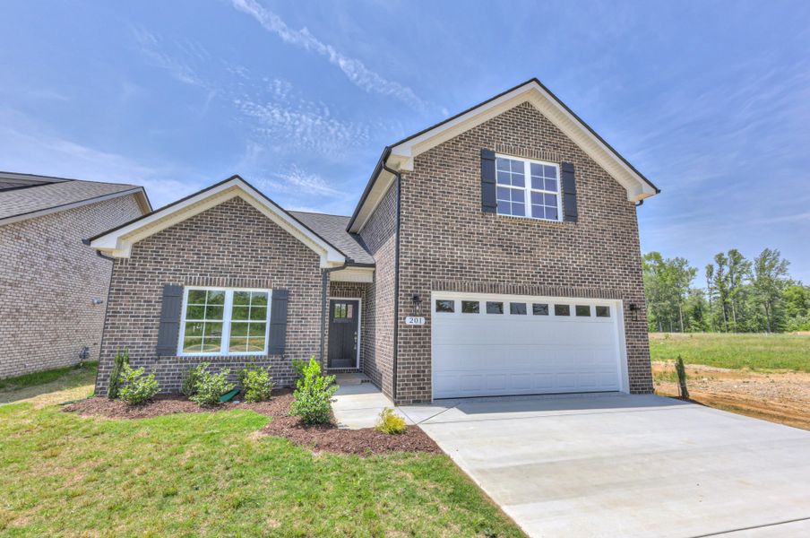 Front exterior of a new home in Legacy Preserve, Tullahoma, TN, highlighting curb appeal (Image 16). Front exterior of a new home in Legacy Preserve, Tullahoma, TN, highlighting curb appeal (Image 16).