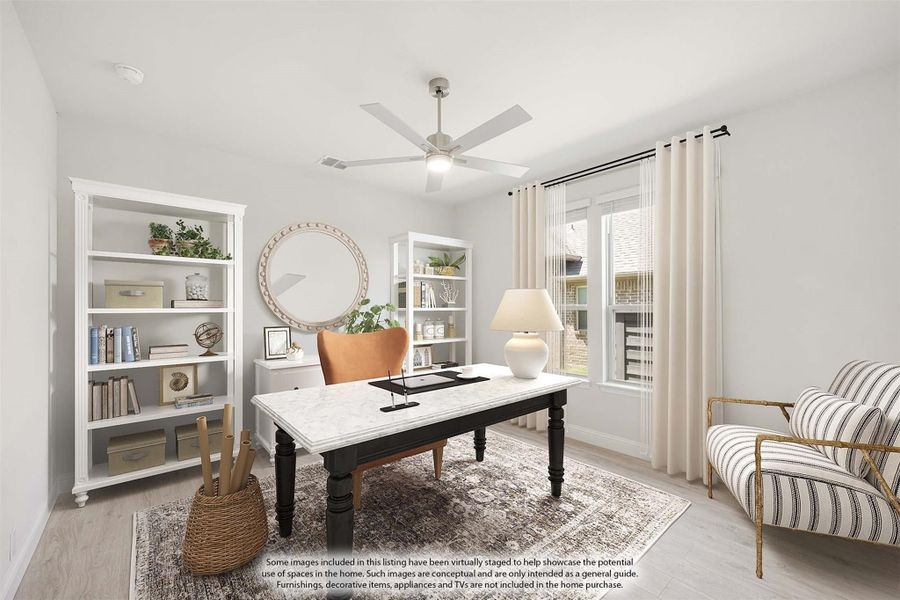Home office with marble-top desk, white bookshelves, ceiling fan, and light wood floors