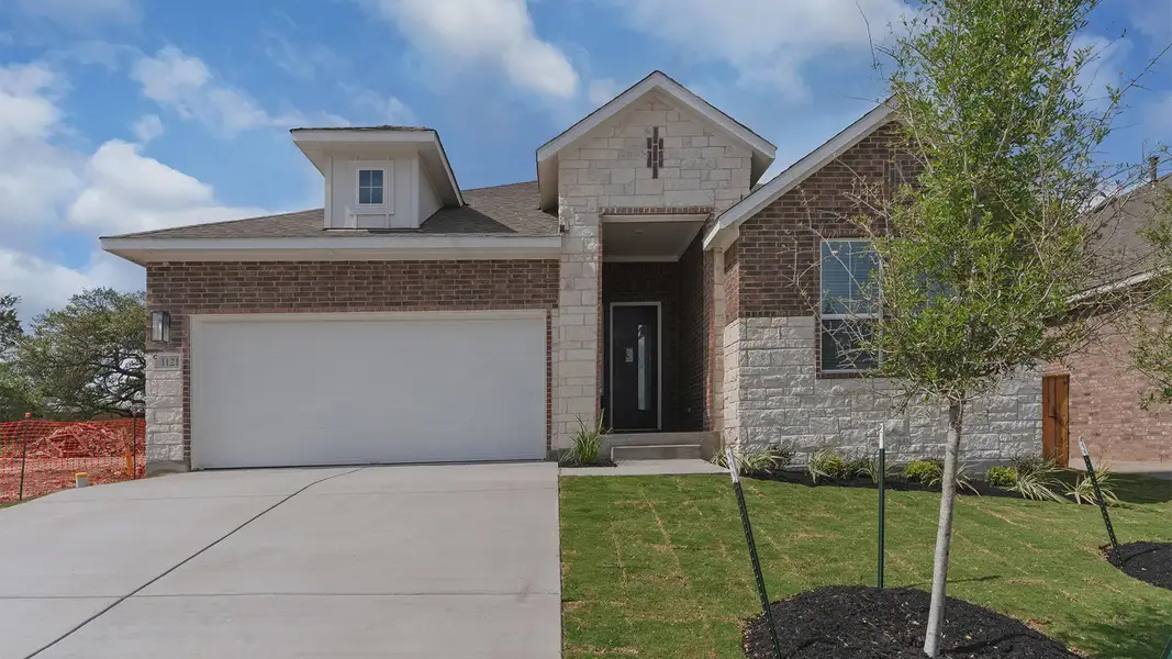 Front exterior of a new home in Parkside on the River, Georgetown, TX, highlighting curb appeal (Image 1). Front exterior of a new home in Parkside on the River, Georgetown, TX, highlighting curb appeal (Image 1).