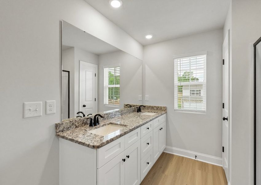 The master bathroom has double sinks