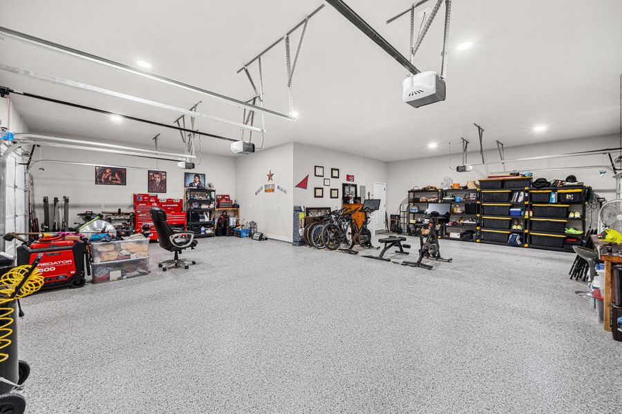 Ample space for storage and recreation in this fully equipped, well-lit garage. Ample space for storage and recreation in this fully equipped, well-lit garage.