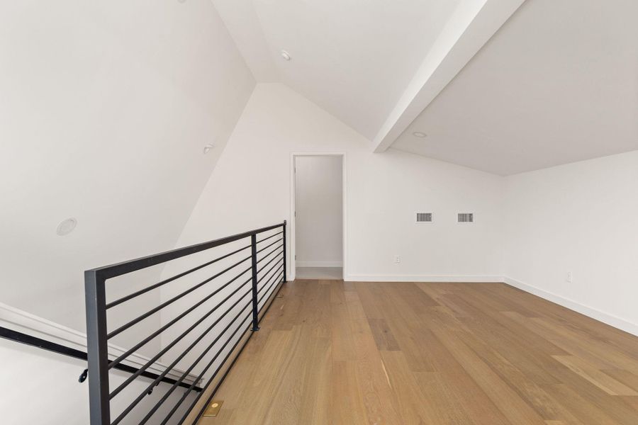 Lofty ceilings and hardwood flooring define this versatile bonus room, perfect for any need.