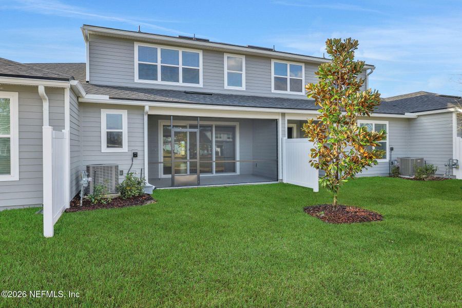 Exterior details and patio area of a home in Cherry Elm at SilverLeaf, St. Augustine (Image 4).
