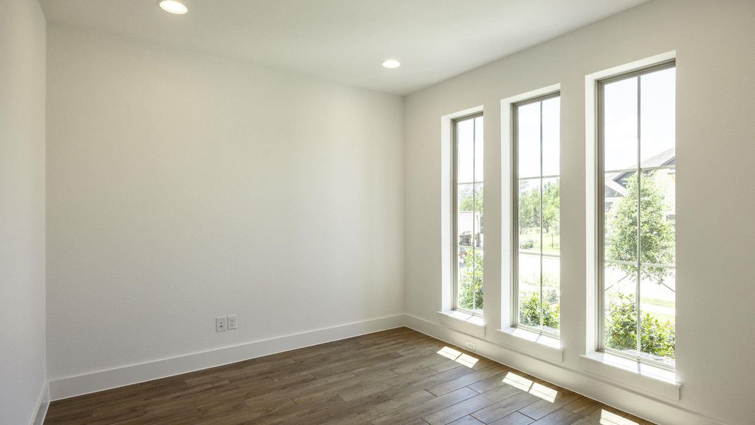 Unfurnished room featuring dark wood finished floors and recessed lighting Unfurnished room featuring dark wood finished floors and recessed lighting