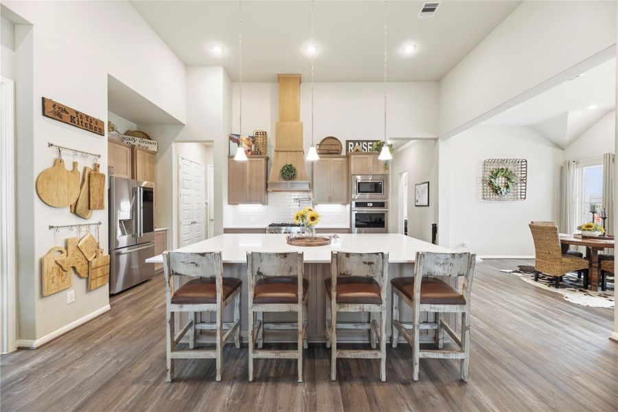 Kitchen with island for extra sitting