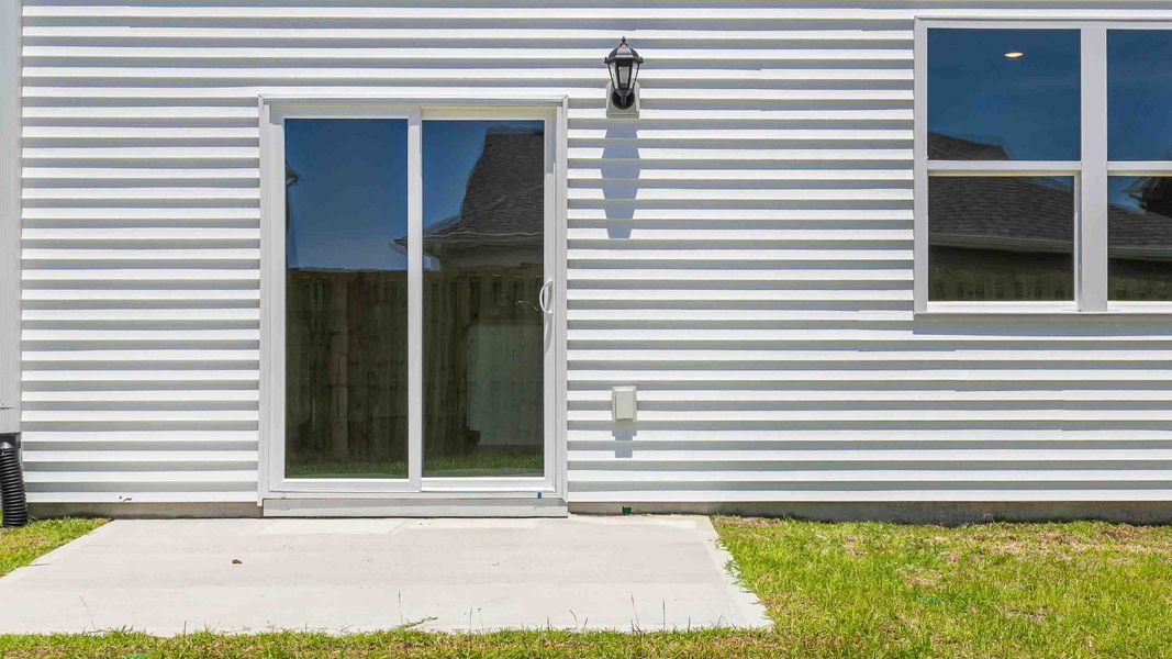Front exterior of a new home in Bella Point, Bolivia, NC, highlighting curb appeal (Image 2).