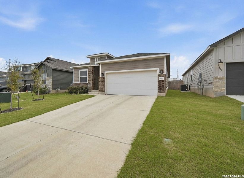 Front exterior of a new home in Hunter's Ranch, San Antonio, TX, highlighting curb appeal (Image 20).