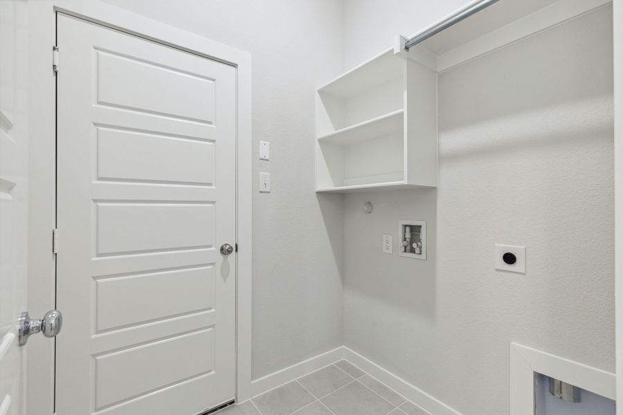 Utility Room in the Ash home plan by Trophy Signature Homes – REPRESENTATIVE PHOTO