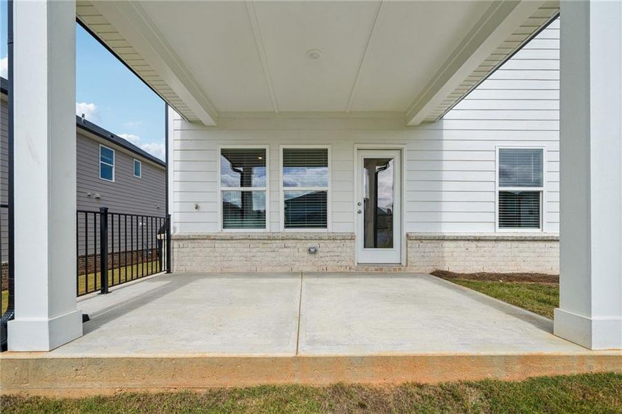 Exterior details and patio area of a home in Martin Springs - Reserve Series, Lawrenceville (Image 21).