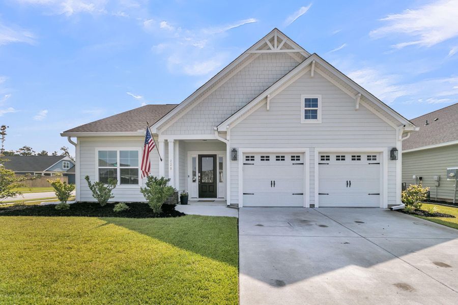 Front exterior of a new home in Hewing Farms, Summerville, SC, highlighting curb appeal (Image 23).