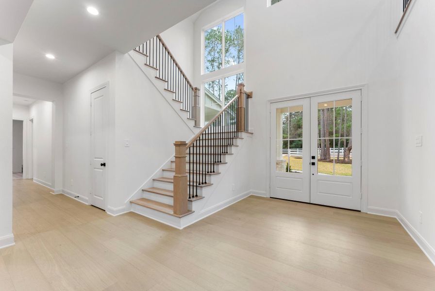 Gorgeous oak flooring flows throughout the downstairs of this stunning home.