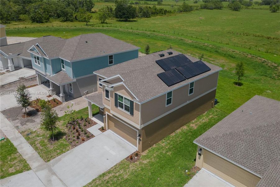 Front exterior of a new home in Inman Groves, Winter Haven, FL, highlighting curb appeal (Image 22). Front exterior of a new home in Inman Groves, Winter Haven, FL, highlighting curb appeal (Image 22).