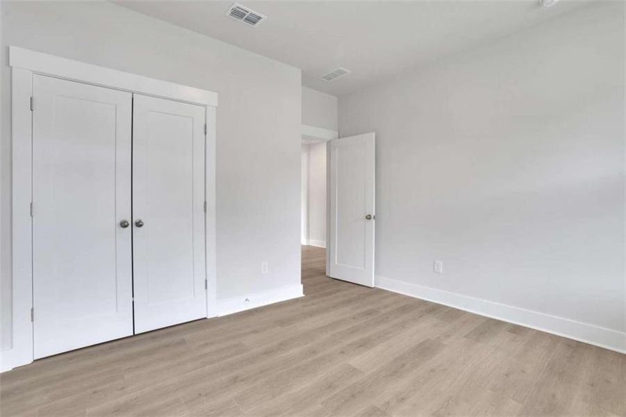 Spacious, unfurnished interior of a new home in The Paddocks at Doc Hughes, Buford (Image 37).