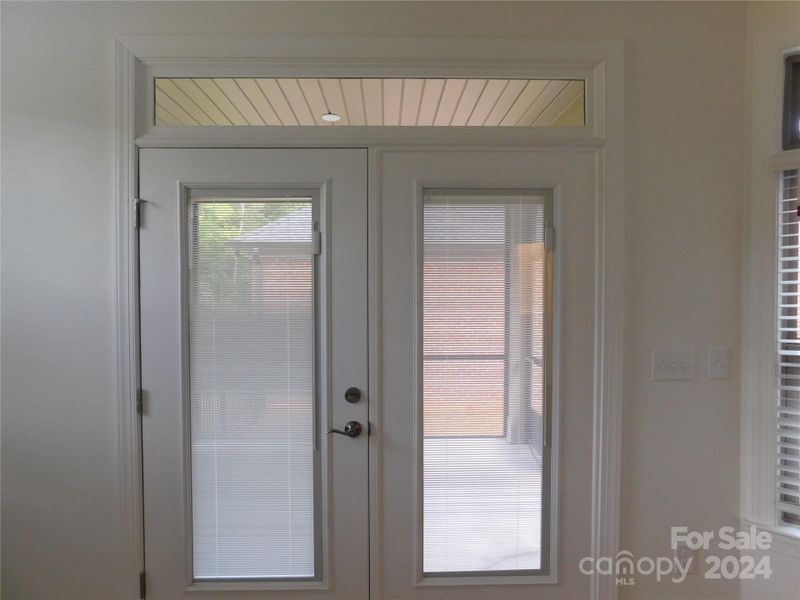 French Doors leading to screened porch off of Primary Bedroom