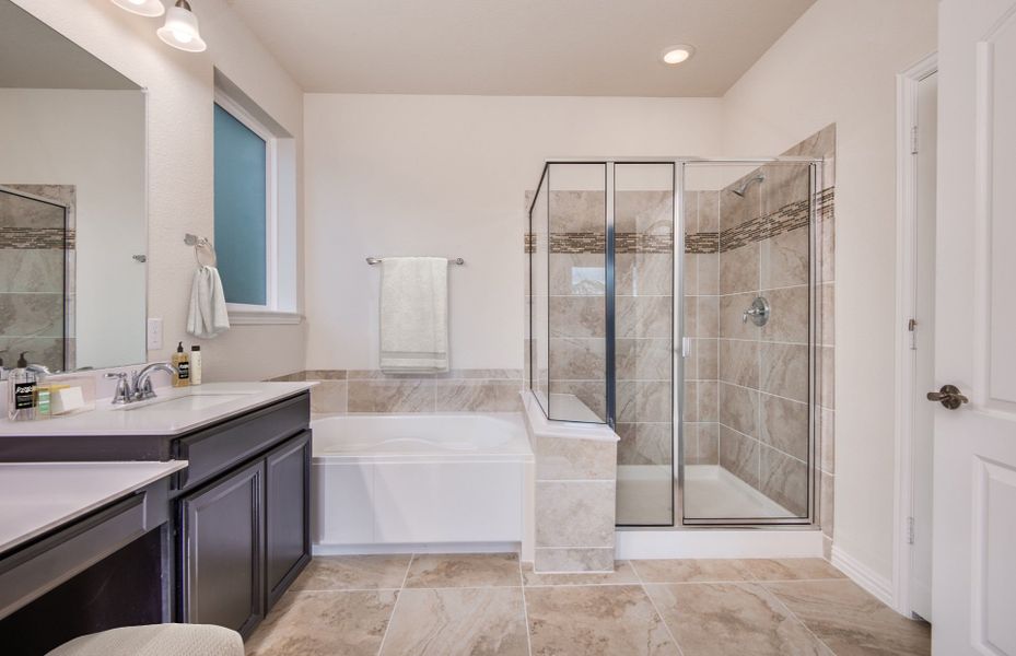 Private Owner's Bath with Walk-In Shower and Soaking Tub
