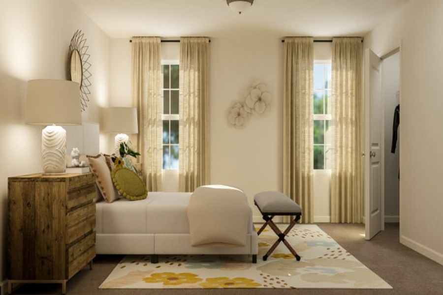 A living room with a white couch and a white chair.