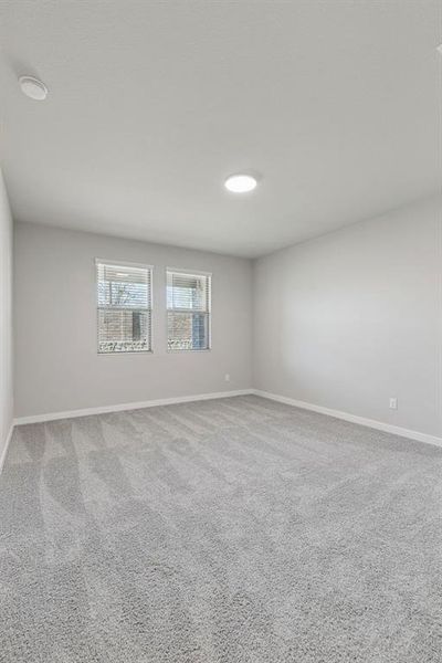 Primary Suite in the Holden home plan by Trophy Signature Homes – REPRESENTATIVE PHOTO