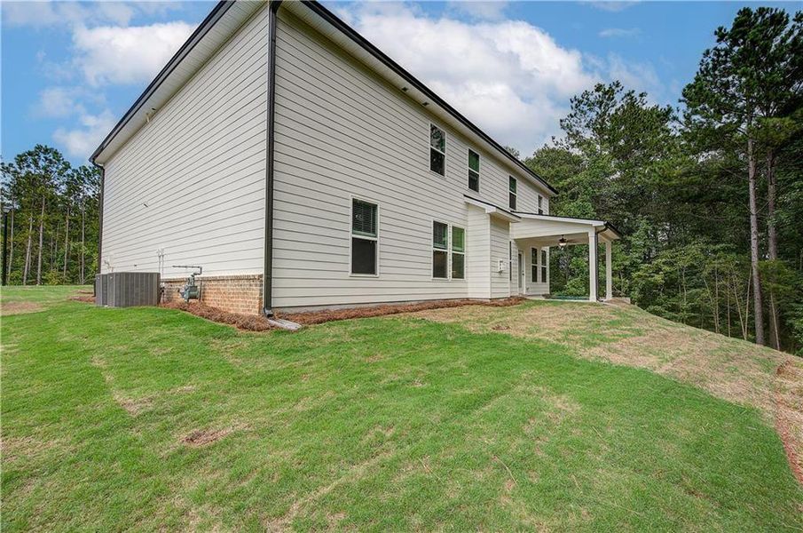 Front exterior of a new home in Kingston, Locust Grove, GA, highlighting curb appeal (Image 19). Front exterior of a new home in Kingston, Locust Grove, GA, highlighting curb appeal (Image 19).