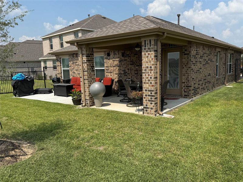 Front exterior of a new home in Sunterra, Katy, TX, highlighting curb appeal (Image 18). Front exterior of a new home in Sunterra, Katy, TX, highlighting curb appeal (Image 18).