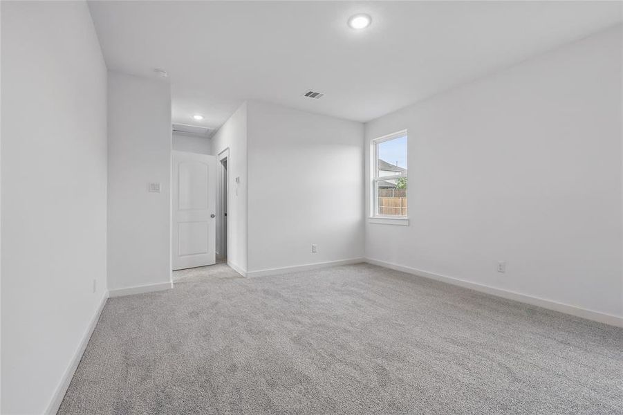 Spare room with light carpet and recessed lighting