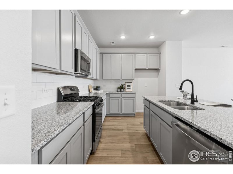 Furnished interior view inside a new home in Kinston Mainstreet Townhomes, Loveland (Image 18). Furnished interior view inside a new home in Kinston Mainstreet Townhomes, Loveland (Image 18).