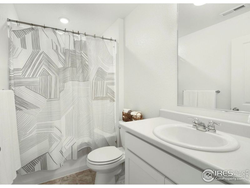 The upstairs full hall bath. The upstairs full hall bath.