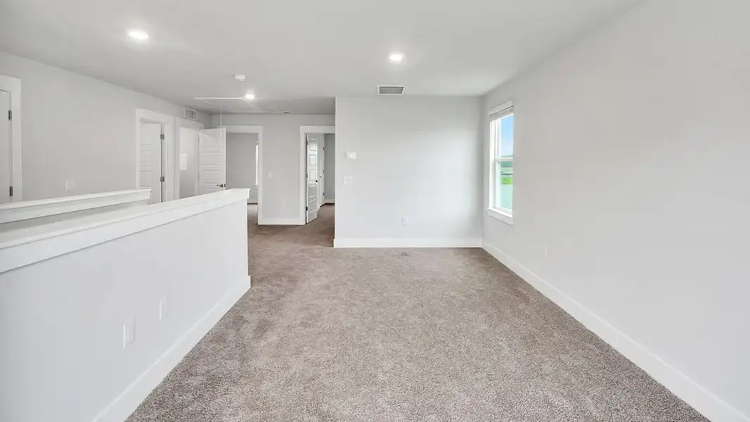 Spacious, unfurnished interior of a new home in The Townes at Cedar Hill Landing, Navassa (Image 24).