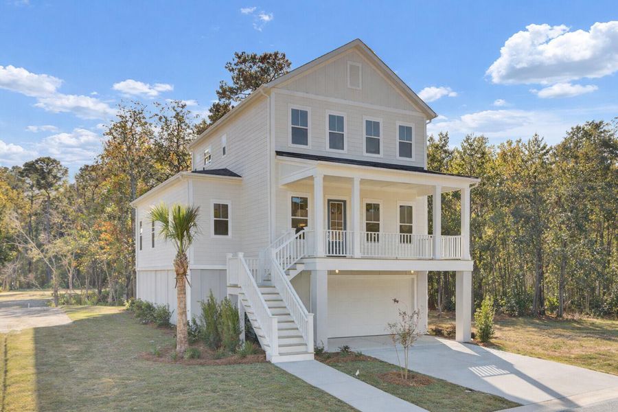 Front exterior of a new home in Indigo Grove Single Family Homes, Johns Island, SC, highlighting curb appeal (Image 1). Front exterior of a new home in Indigo Grove Single Family Homes, Johns Island, SC, highlighting curb appeal (Image 1).