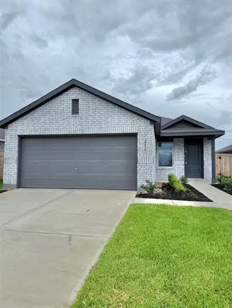 Front exterior of a new home in The Grand Prairie: Cottage Collection, Hockley, TX, highlighting curb appeal (Image 2).