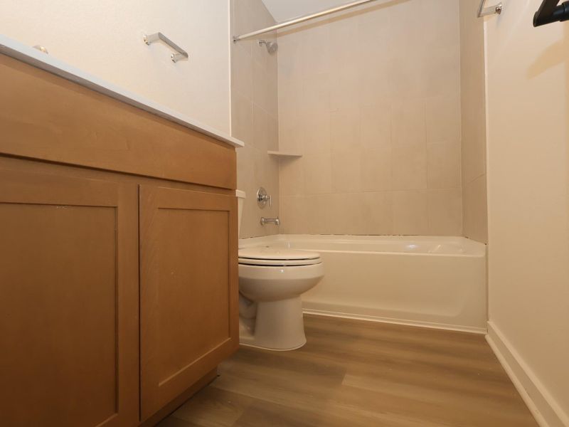 Furnished interior view inside a new home in Lone Star Landing, Montgomery (Image 12).