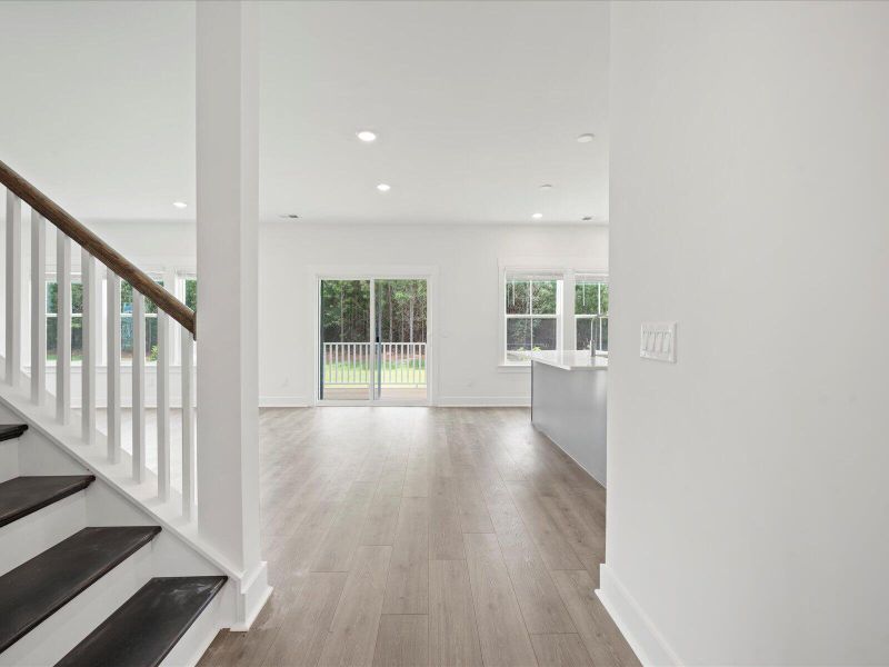 Spacious, unfurnished interior of a new home in The Coves at Lakes of Cane Bay, Summerville (Image 19).