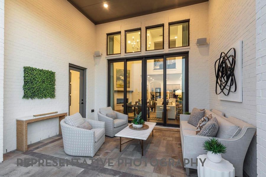 Exterior details and patio area of a home in Meridiana, Manvel (Image 2).