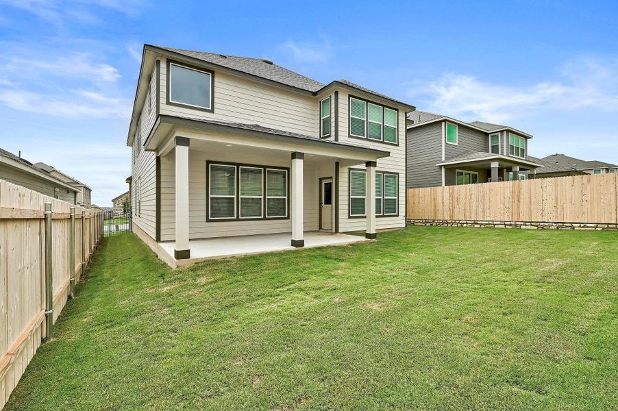Front exterior of a new home in McKinney Crossing, Austin, TX, highlighting curb appeal (Image 1). Front exterior of a new home in McKinney Crossing, Austin, TX, highlighting curb appeal (Image 1).
