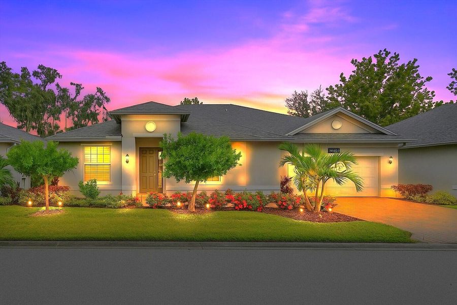 Front exterior of a new home in Bella Rosa, Vero Beach, FL, highlighting curb appeal (Image 22). Front exterior of a new home in Bella Rosa, Vero Beach, FL, highlighting curb appeal (Image 22).