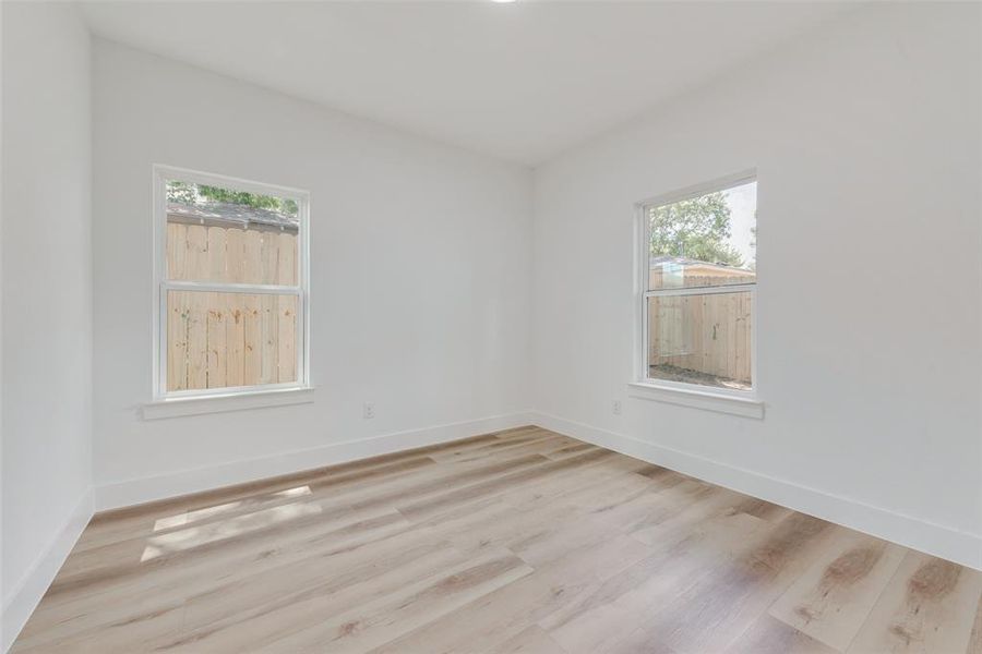 Unfurnished room featuring light wood-type flooring