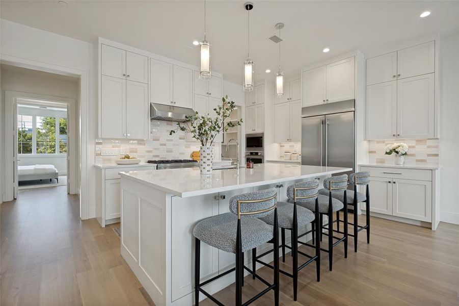 State-of-the-art stainless steel appliances, designer surfaces, and abundant storage make this kitchen a dream. State-of-the-art stainless steel appliances, designer surfaces, and abundant storage make this kitchen a dream.
