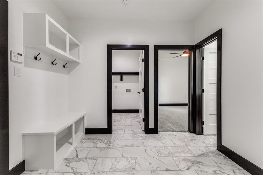 Mud room area leading to laundry room