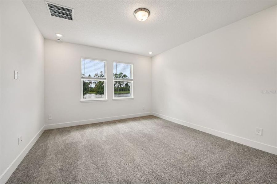 Spacious, unfurnished interior of a new home in Legends Preserve - Signature Series, Daytona Beach (Image 24).