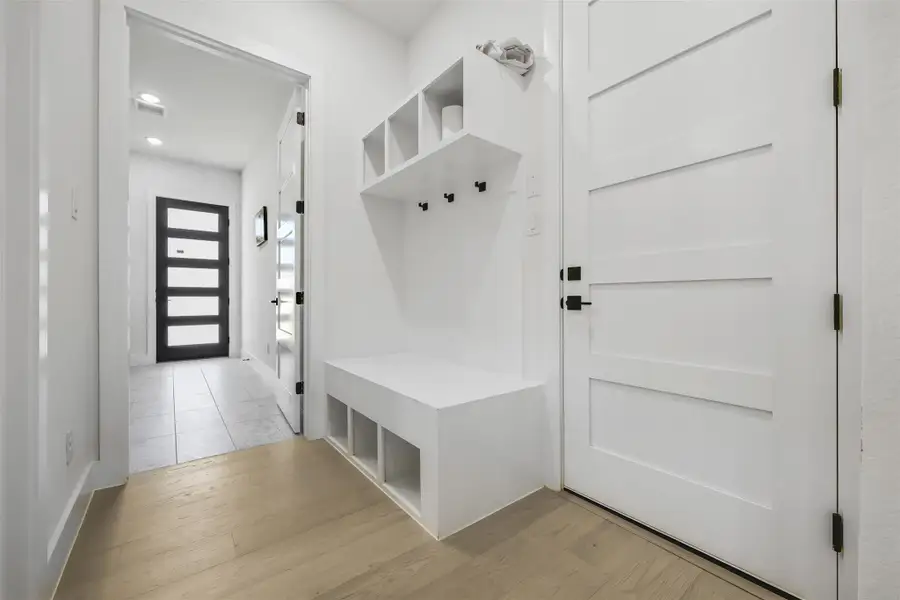 Mudroom with light wood-style flooring and recessed lighting