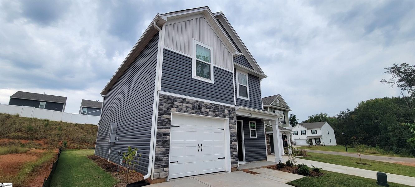 Front exterior of a new home in Hazelwood, Boiling Springs, SC, highlighting curb appeal (Image 2). Front exterior of a new home in Hazelwood, Boiling Springs, SC, highlighting curb appeal (Image 2).